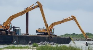 cranes dropping rocks